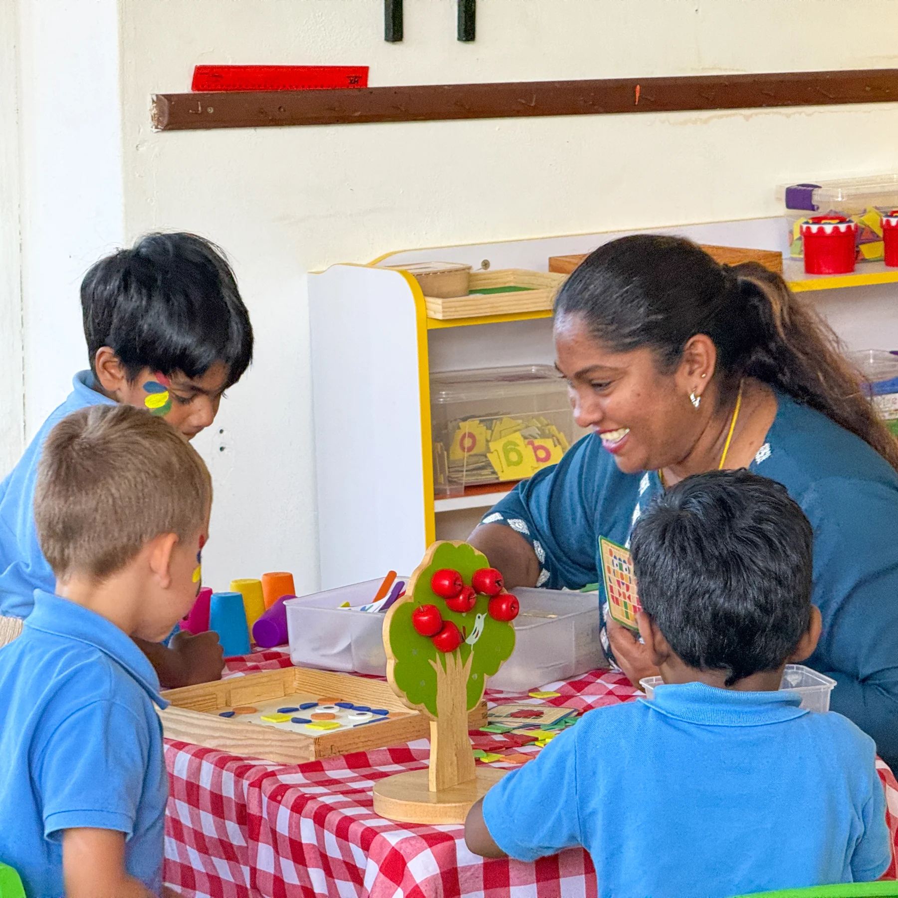 Children taking part in a classroom activity with their teacher